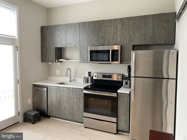 a bathroom with a shower and a mirror