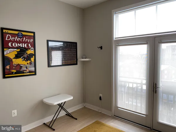 a living room with a couch and a rug