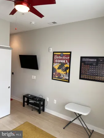 a bedroom with a bed and a mirror