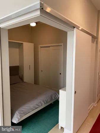 a bedroom with a bed and a view of bedroom