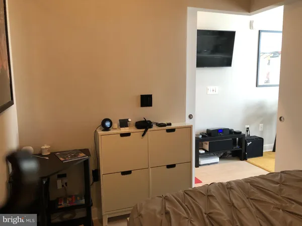 a view of a patio with table and chairs and potted plants
