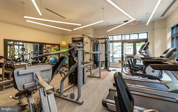 a view of a building with car parked