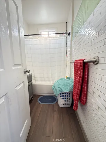 a bathroom with a window toilet and sink