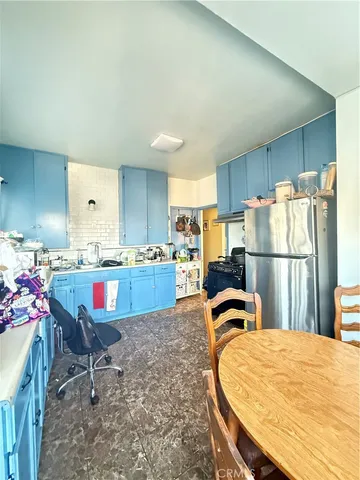 a bedroom with bed and a mirror