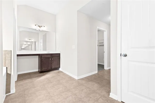 a view of a bathroom with a sink and a mirror