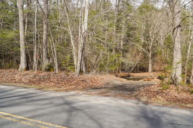a view of a backyard of the house