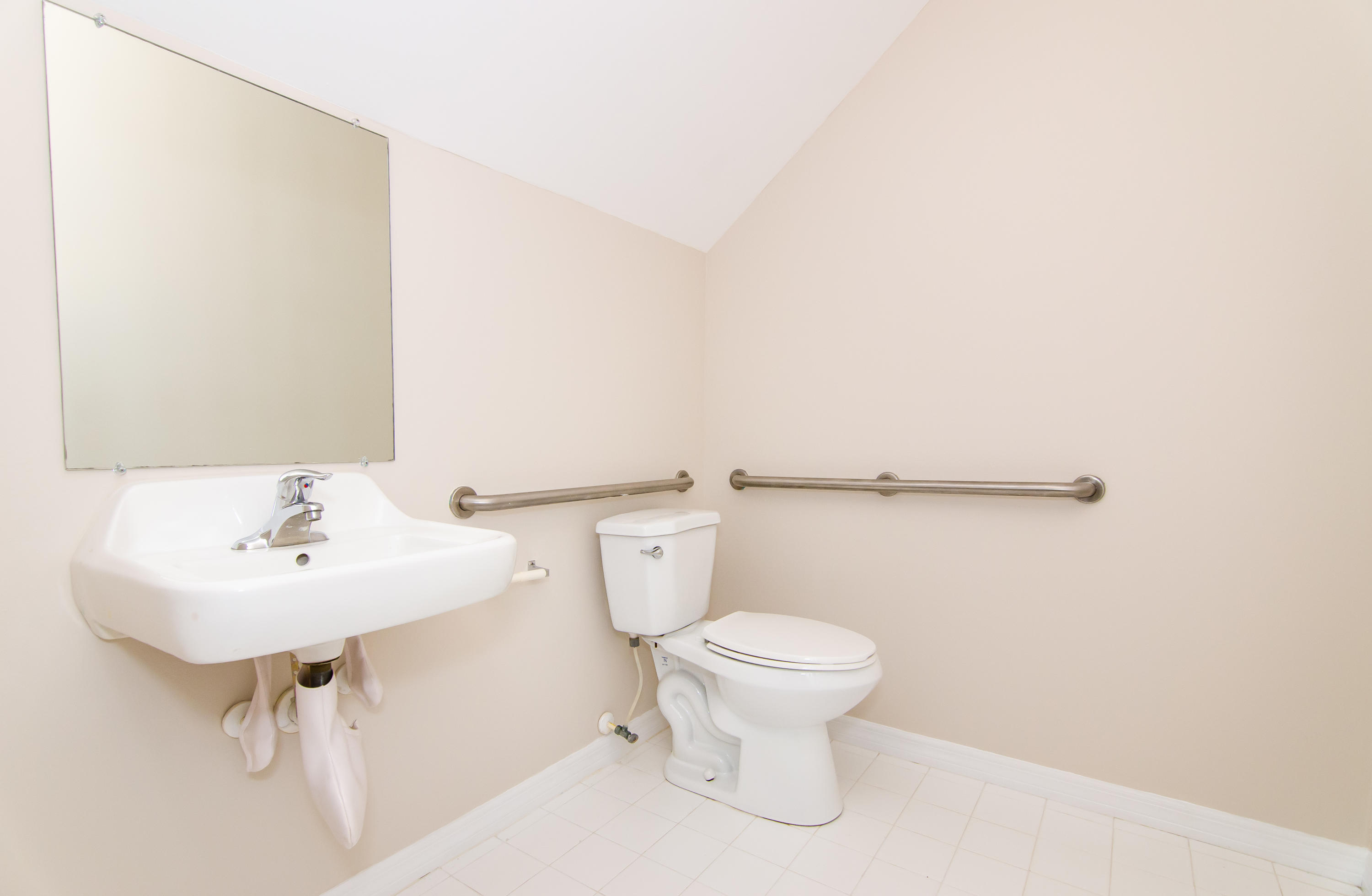 4281 East Main Street Jupiter, FL 33458 - Photo 17 of 37 a bathroom with a sink a toilet and mirror