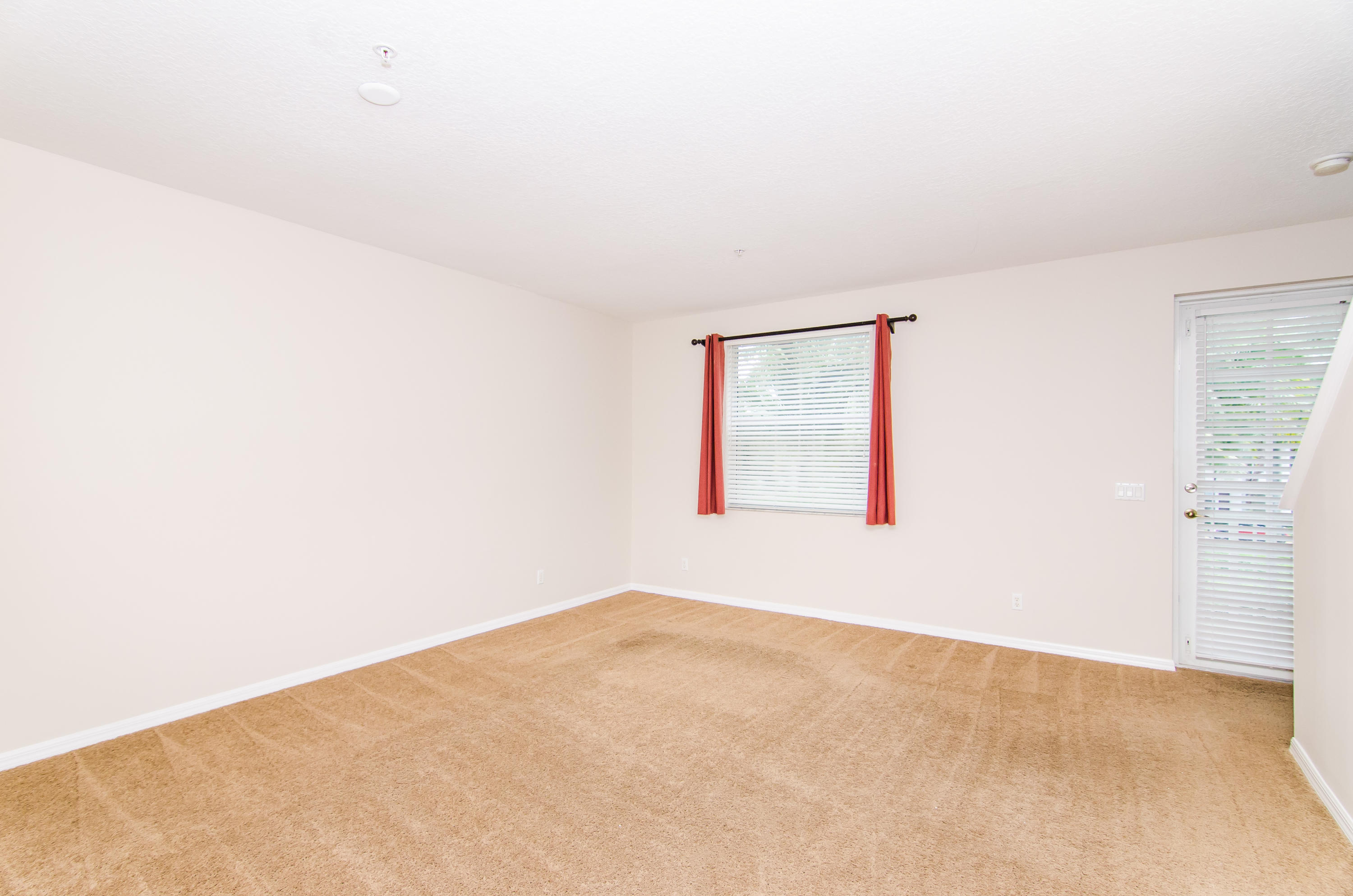 4281 East Main Street Jupiter, FL 33458 - Photo 18 of 37 an empty room with windows