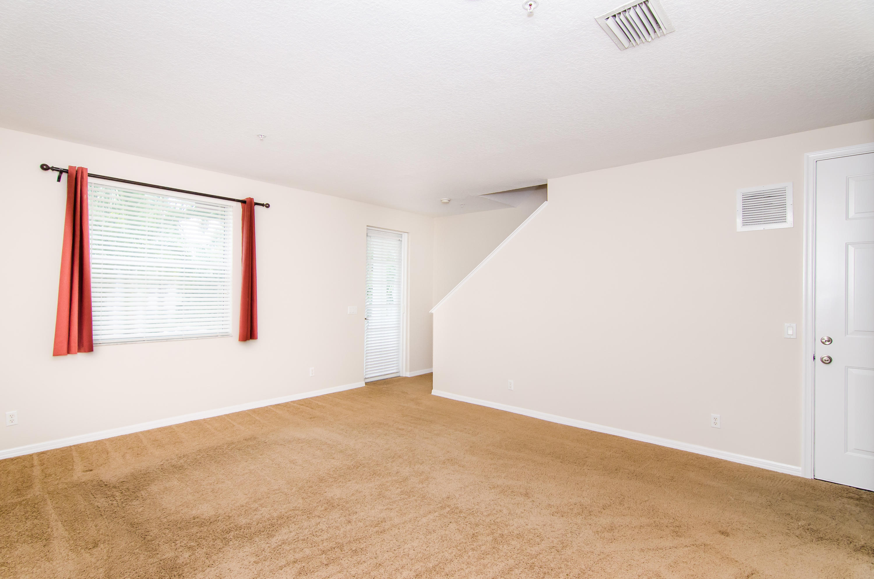 4281 East Main Street Jupiter, FL 33458 - Photo 19 of 37 a view of an empty room with a window