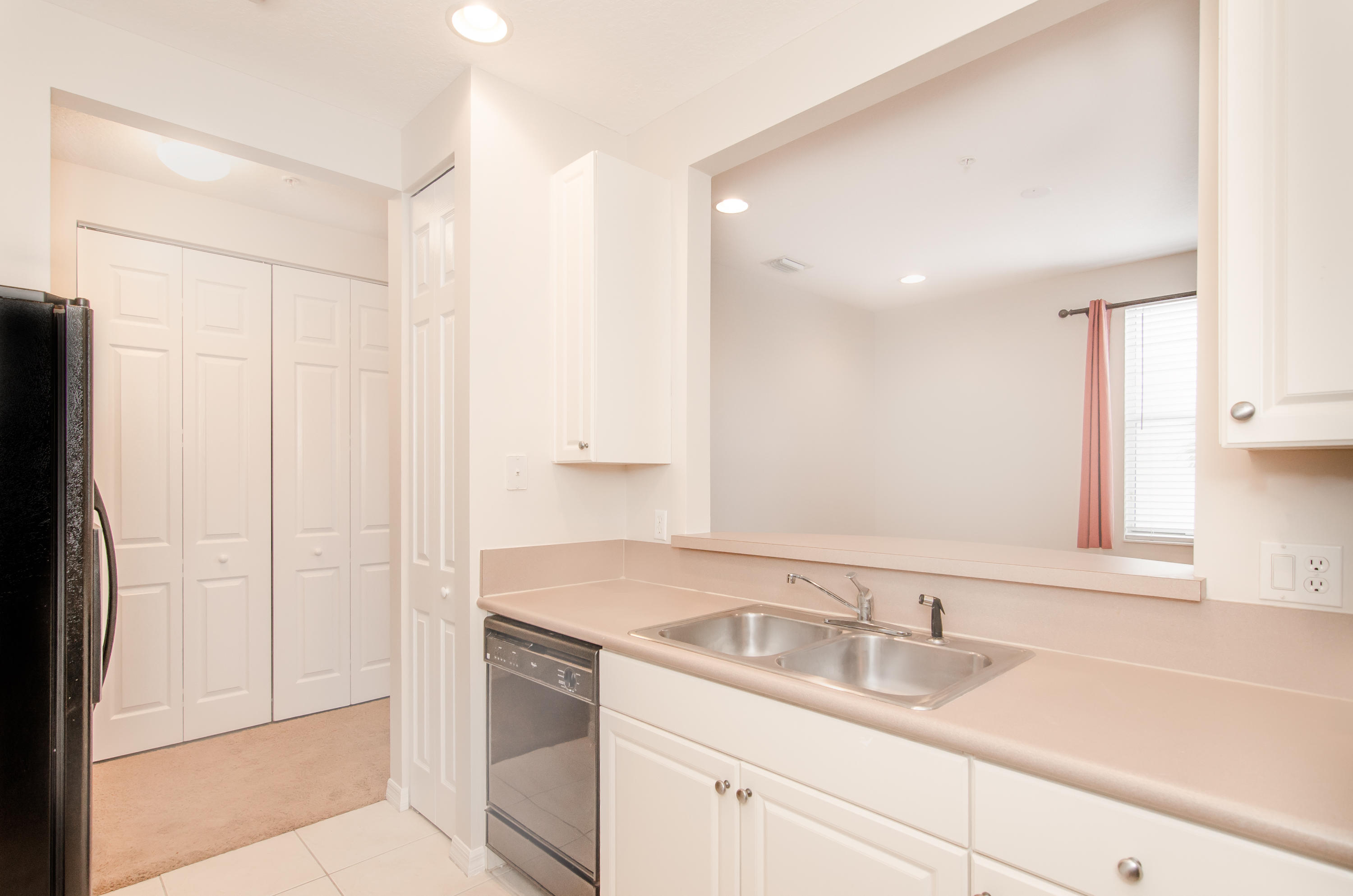 4281 East Main Street Jupiter, FL 33458 - Photo 7 of 37 a bathroom with a sink and a mirror