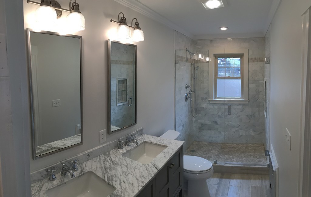 22 Sutherland Road Arlington, MA 02476 - Photo 18 of 30 a bathroom with a granite countertop sink toilet and shower