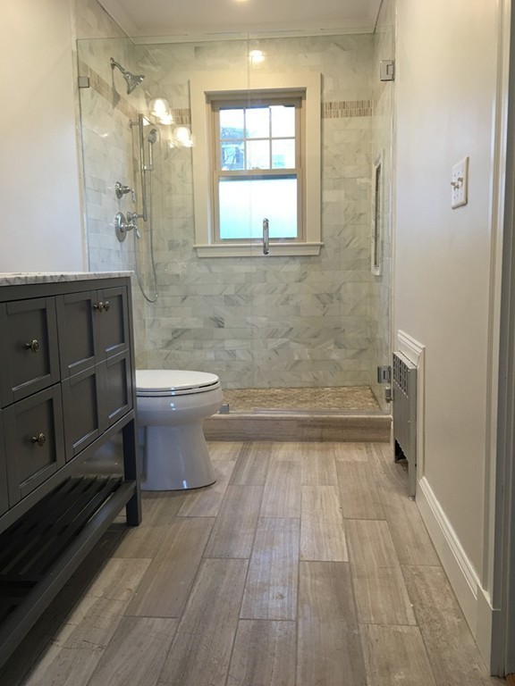 22 Sutherland Road Arlington, MA 02476 - Photo 21 of 30 a bathroom with a sink a toilet and shower