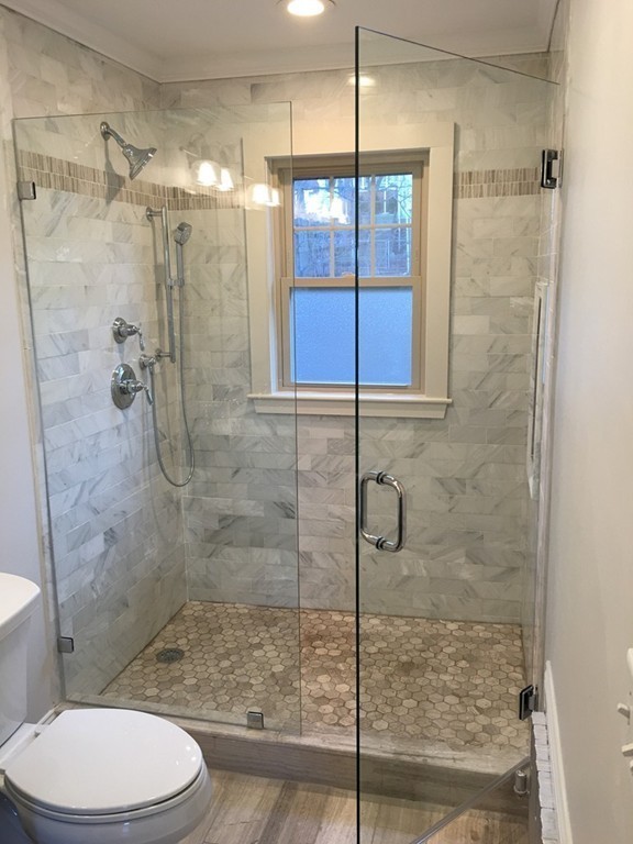 22 Sutherland Road Arlington, MA 02476 - Photo 22 of 30 a bathroom with a shower and a toilet