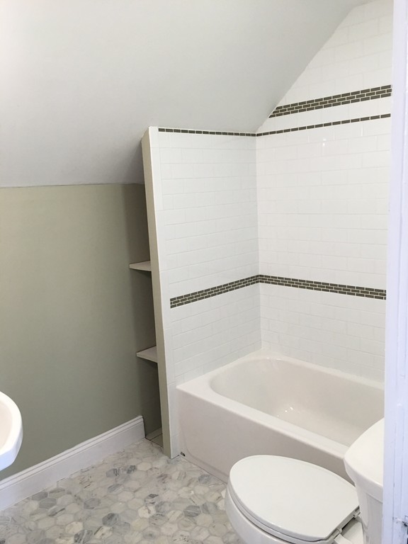 22 Sutherland Road Arlington, MA 02476 - Photo 27 of 30 a bathroom with a toilet and a bathtub