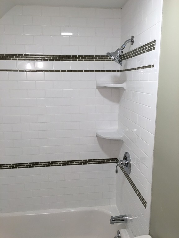 22 Sutherland Road Arlington, MA 02476 - Photo 28 of 30 a bathroom with a shower and tub