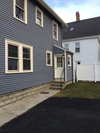 22 Sutherland Road Arlington, MA 02476 - Photo 4 of 30 a house that has a tree in front of it