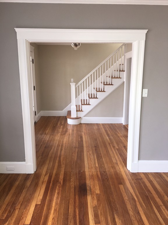 22 Sutherland Road Arlington, MA 02476 - Photo 8 of 30 a view of entryway with wooden floor