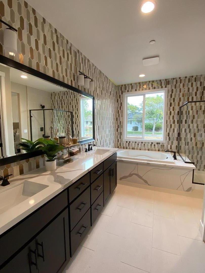 2623 Smith Ranch Walnut Creek, CA 94598 - Photo 10 of 15 a spacious bathroom with a double vanity sink a large mirror and a bathtub next to a window