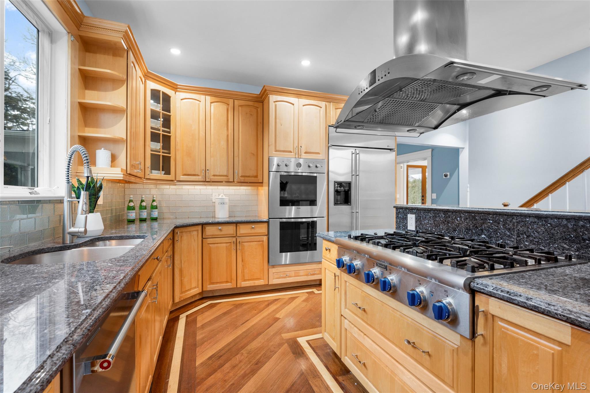 69 Irving Place New Rochelle, NY 10801 - Photo 13 of 46 a kitchen with stainless steel appliances granite countertop a stove and a sink