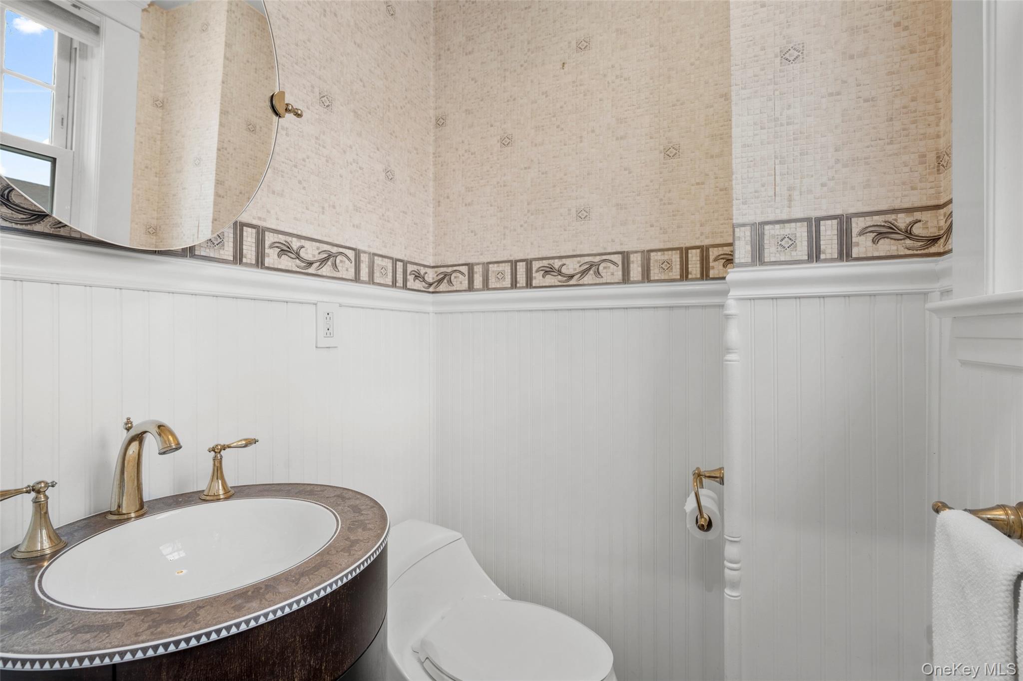 69 Irving Place New Rochelle, NY 10801 - Photo 17 of 46 a bathroom with a toilet and a sink