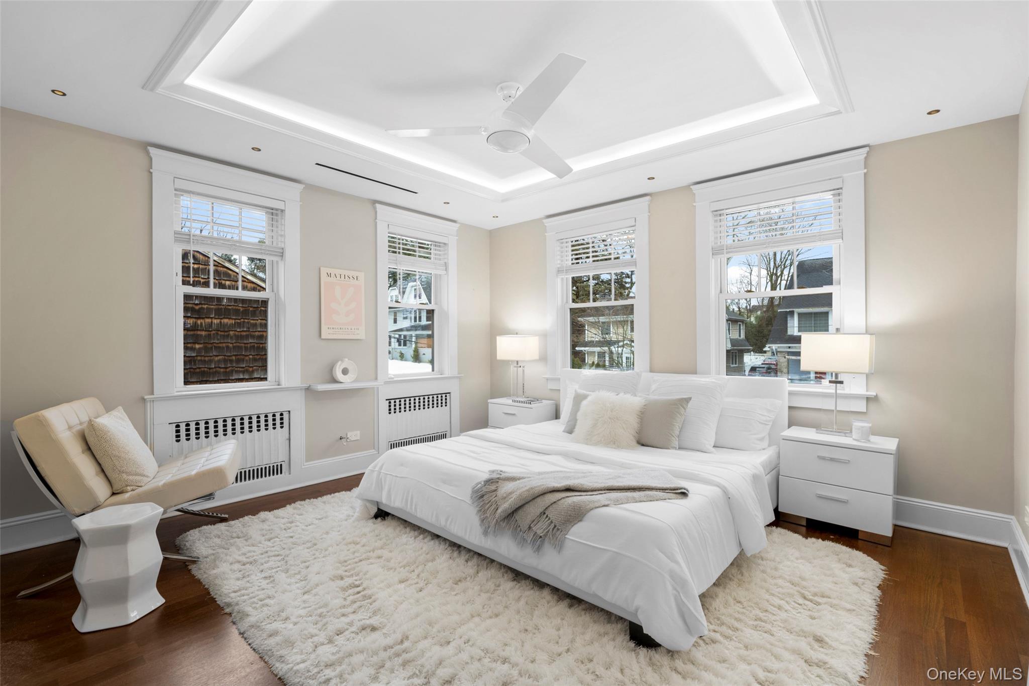 69 Irving Place New Rochelle, NY 10801 - Photo 18 of 46 a spacious bedroom with a large bed and a couch