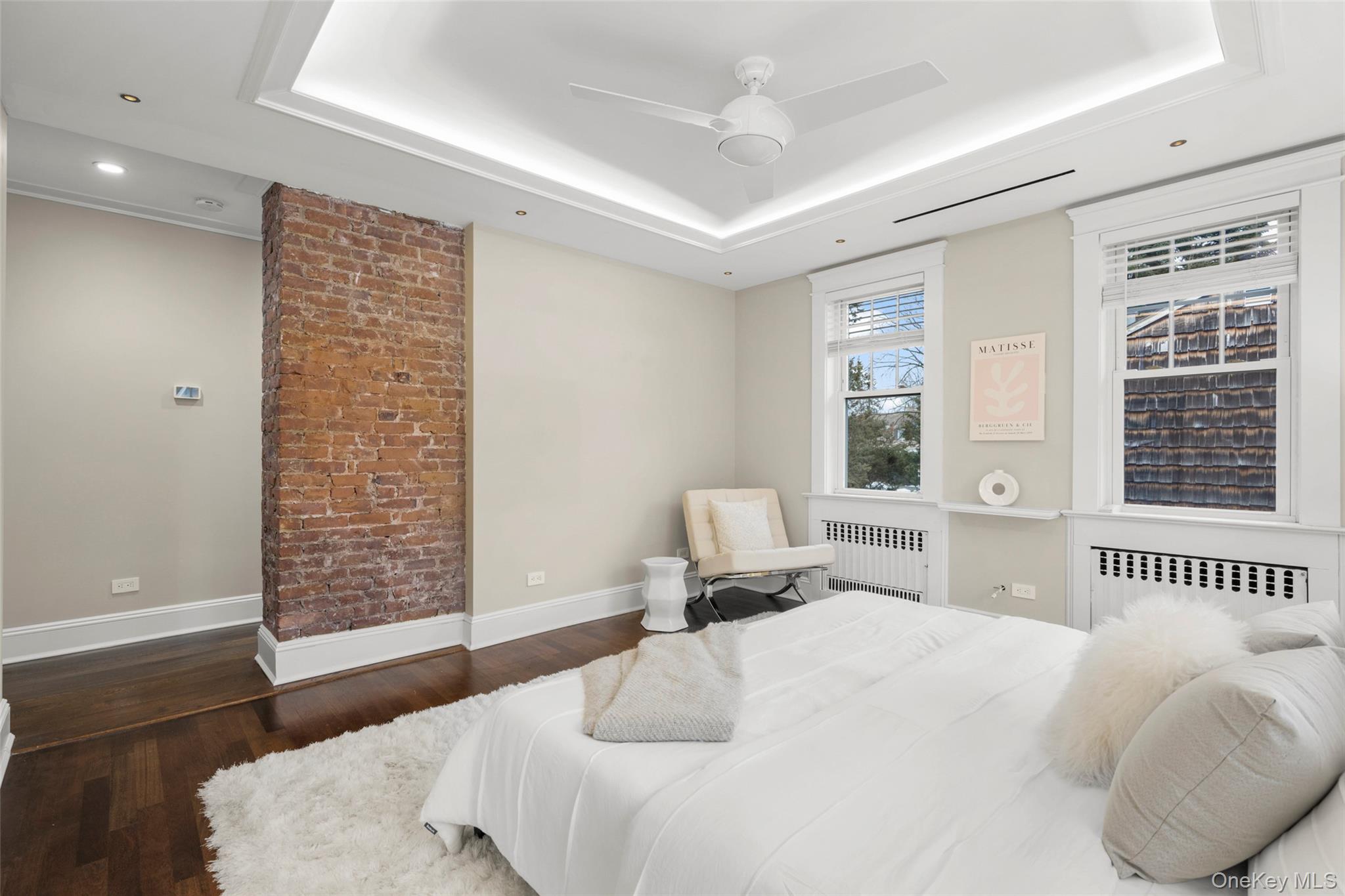 69 Irving Place New Rochelle, NY 10801 - Photo 19 of 46 a bedroom with a bed and wooden floor