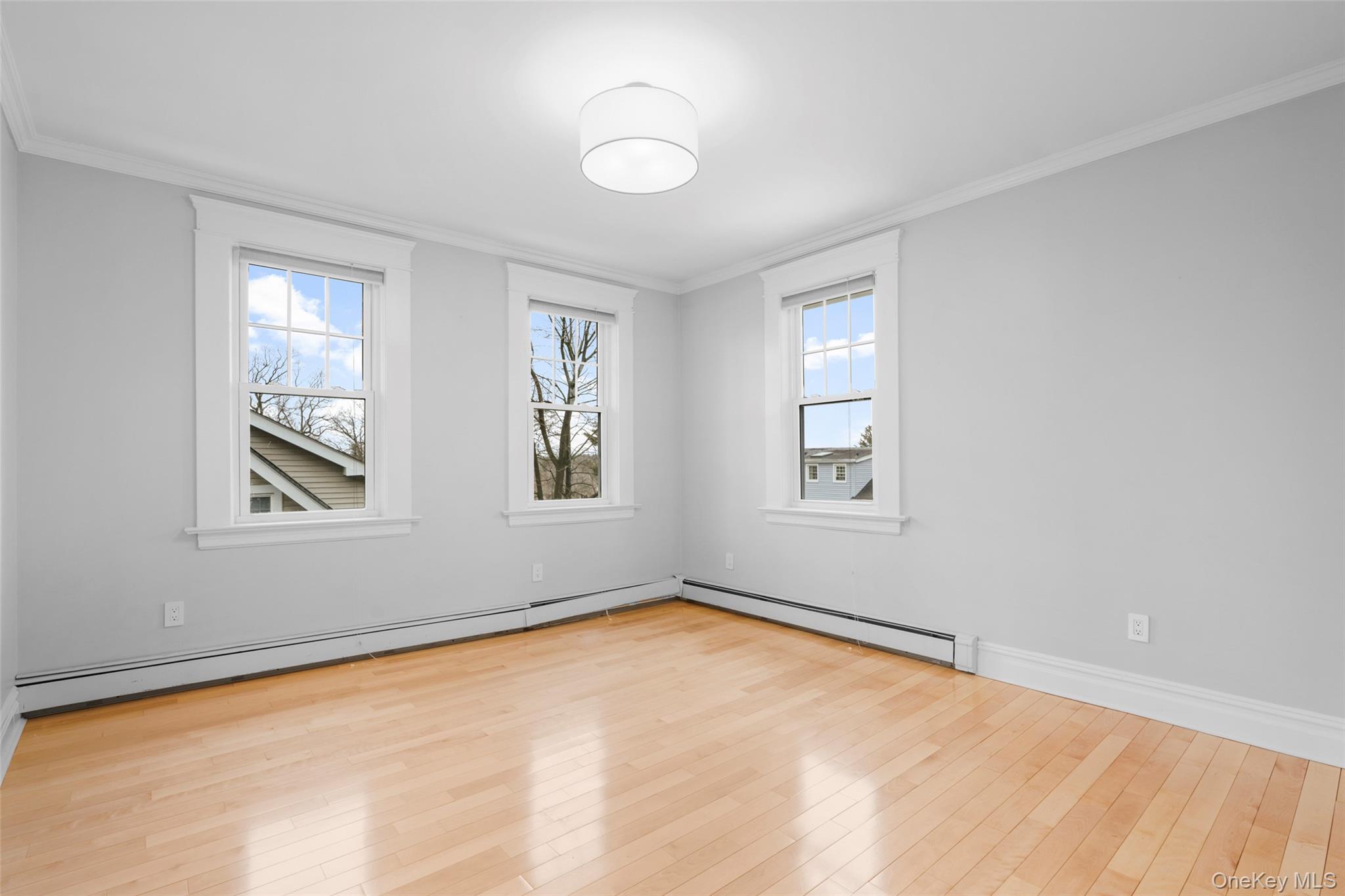 69 Irving Place New Rochelle, NY 10801 - Photo 23 of 46 a view of empty room with windows