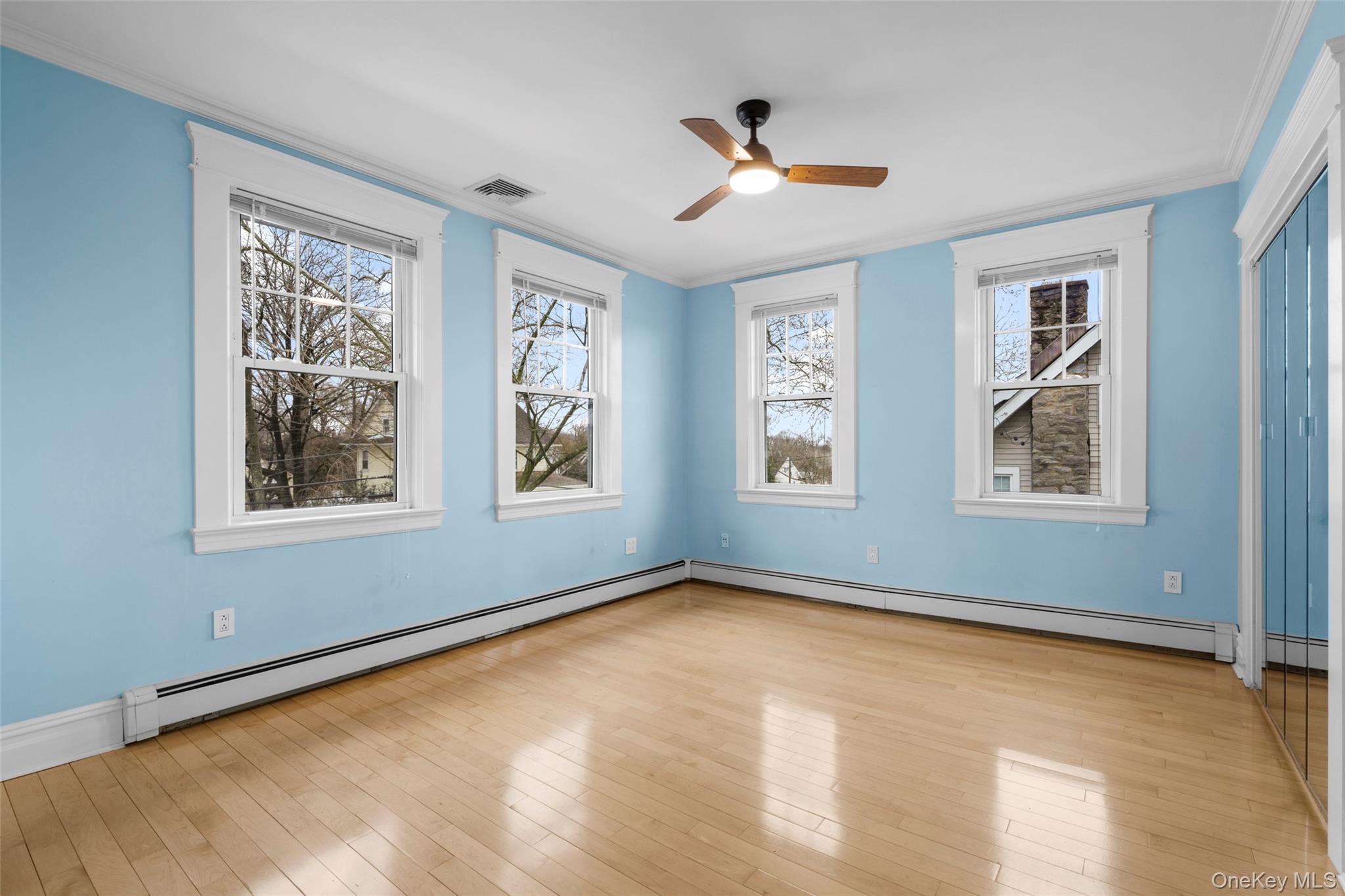 69 Irving Place New Rochelle, NY 10801 - Photo 24 of 46 a view of an empty room with windows