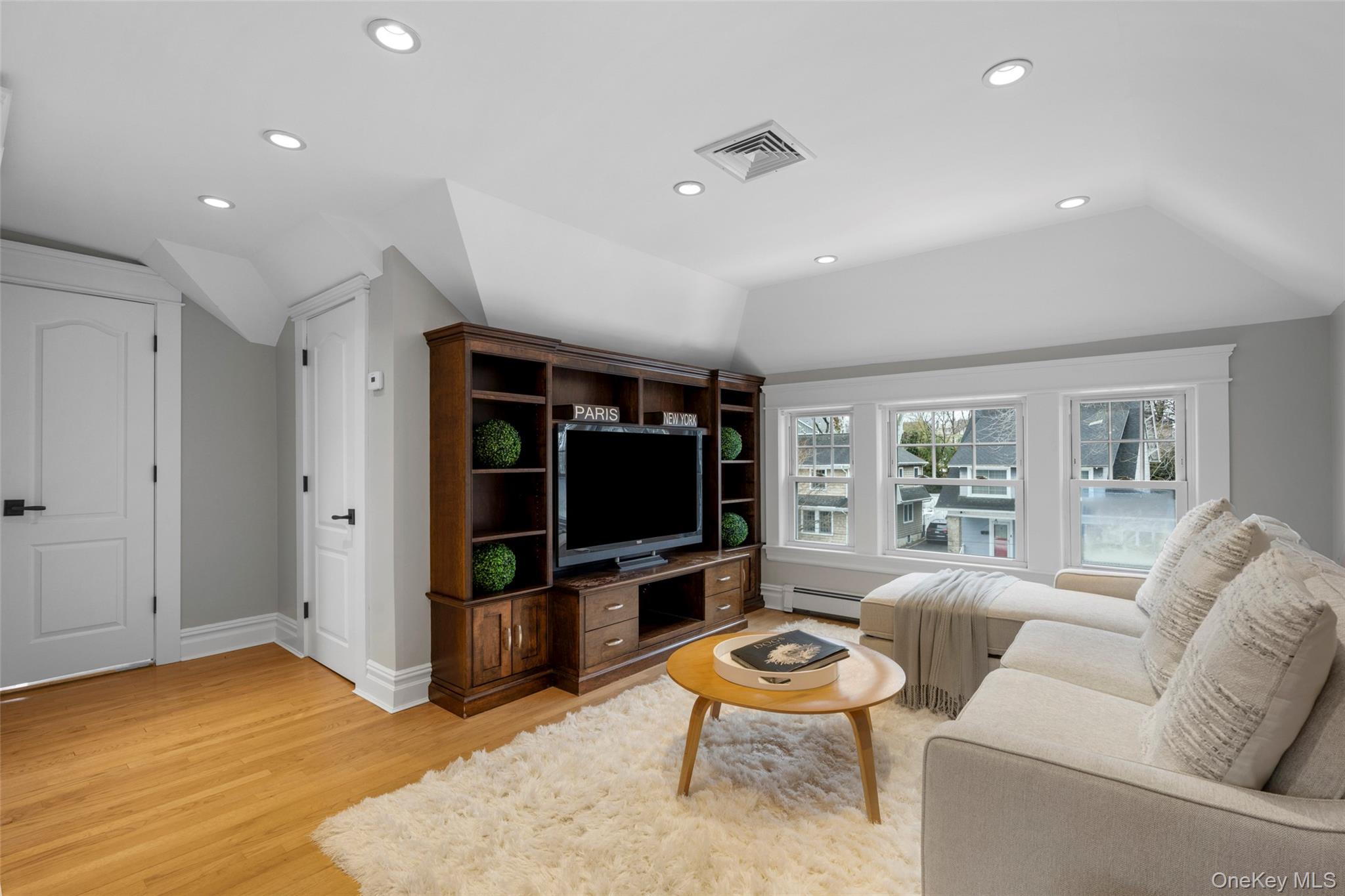 69 Irving Place New Rochelle, NY 10801 - Photo 26 of 46 a living room with furniture and a flat screen tv
