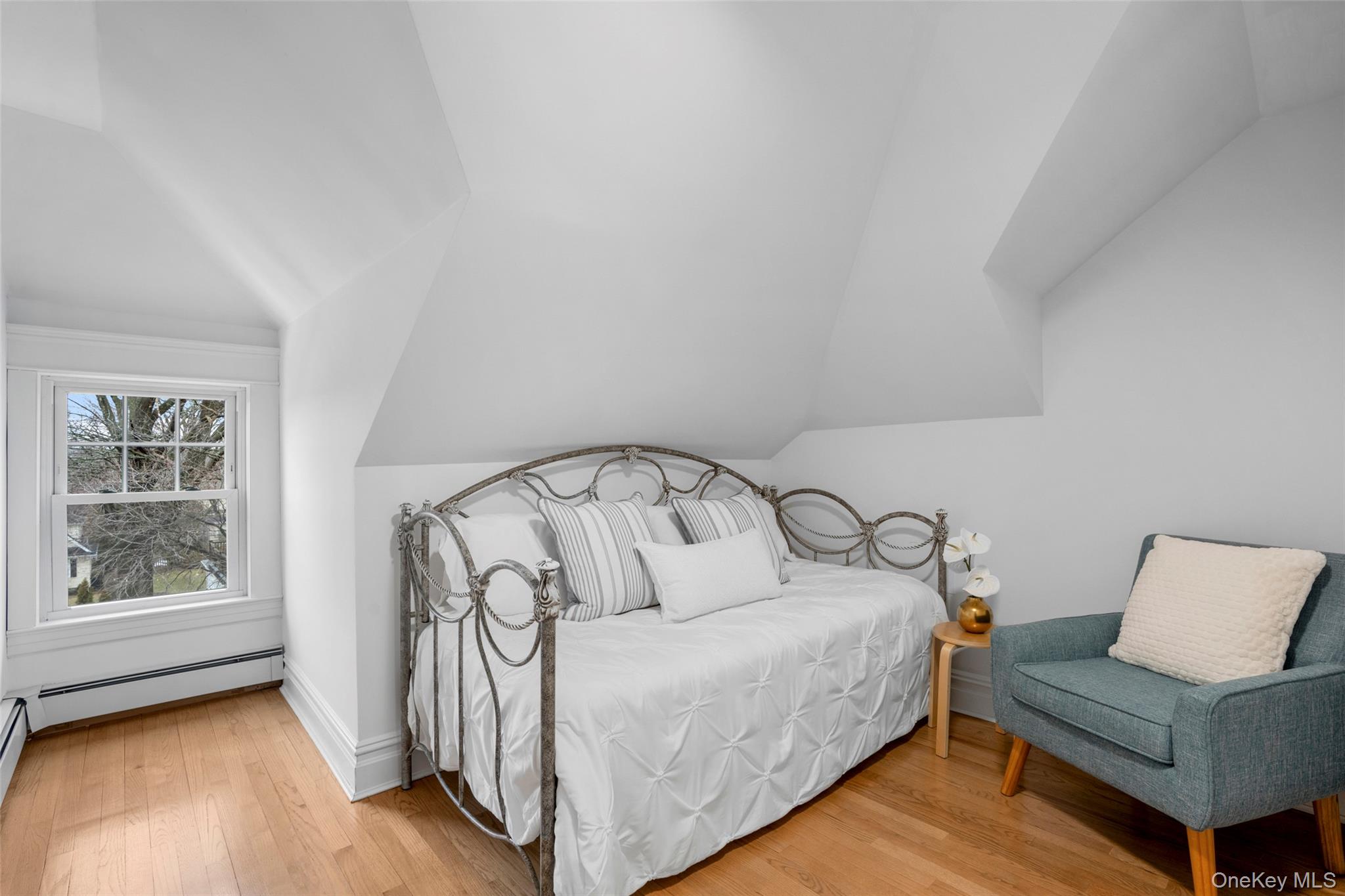 69 Irving Place New Rochelle, NY 10801 - Photo 28 of 46 a bedroom with a bed and a large window