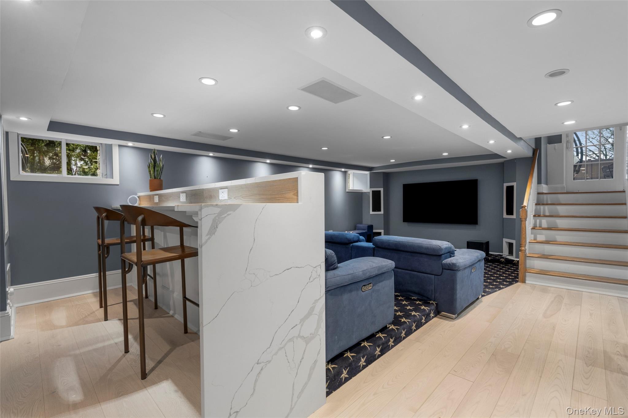 69 Irving Place New Rochelle, NY 10801 - Photo 30 of 46 a living room with furniture and a flat screen tv