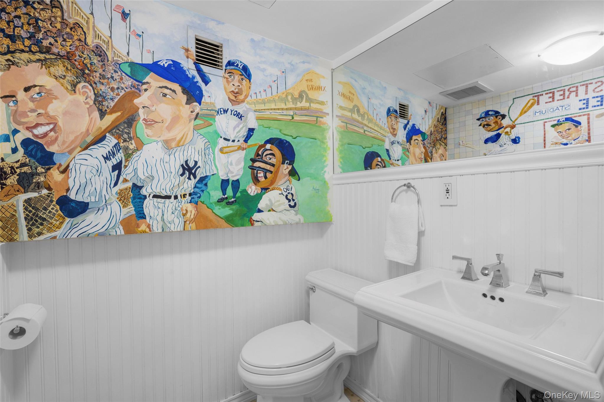 69 Irving Place New Rochelle, NY 10801 - Photo 35 of 46 a bathroom with a sink mirror vanity and toilet