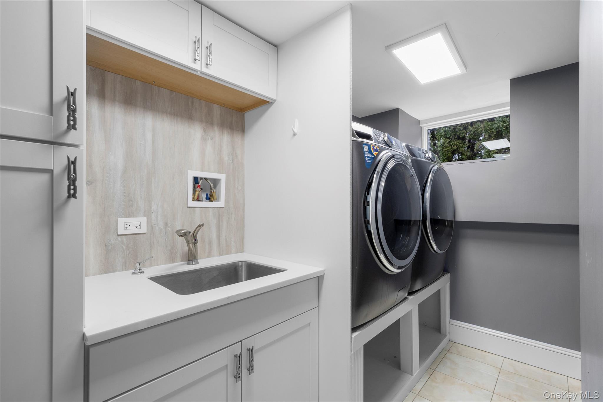 69 Irving Place New Rochelle, NY 10801 - Photo 36 of 46 a utility room with dryer and washer