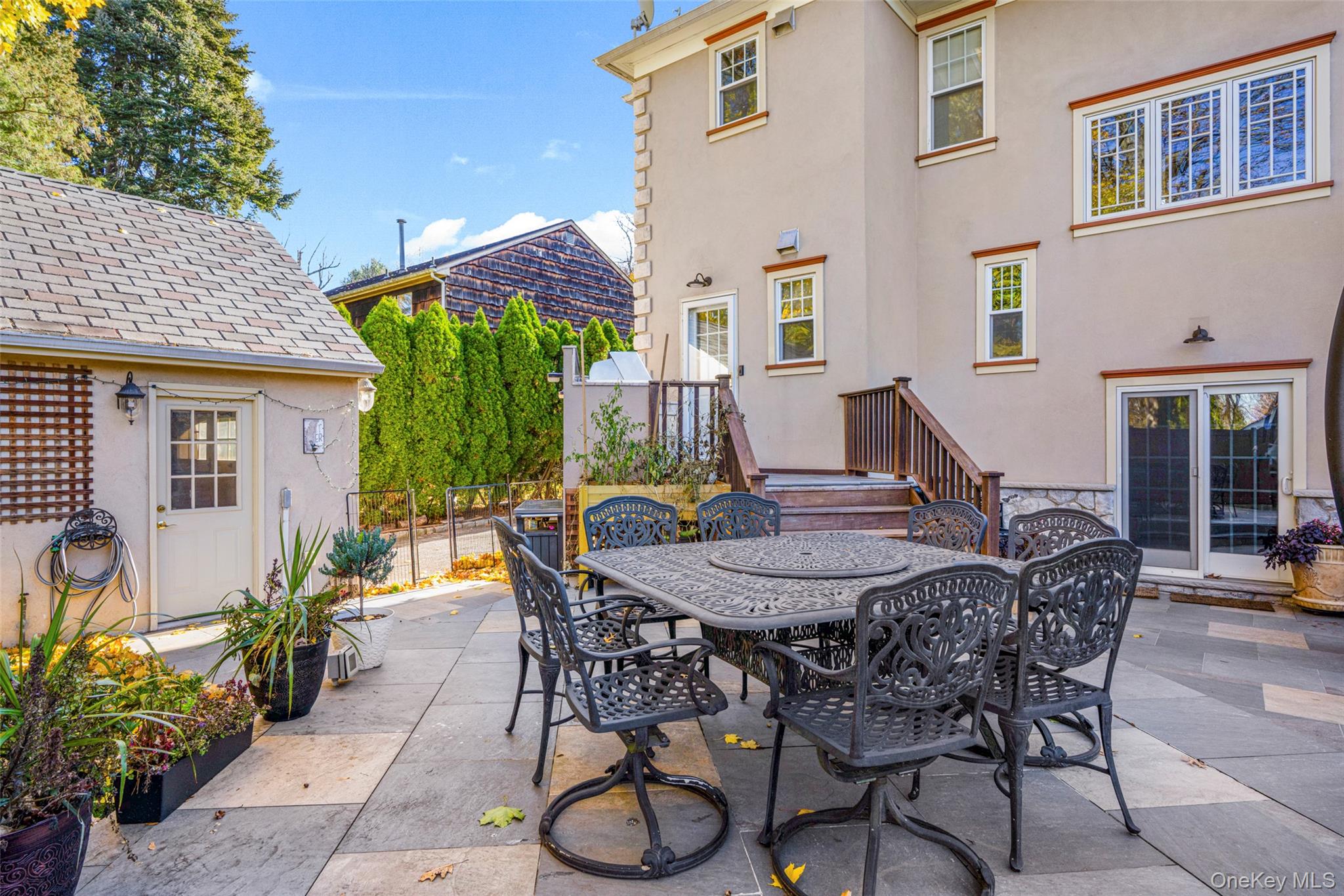 69 Irving Place New Rochelle, NY 10801 - Photo 38 of 46 a view of a patio with table and chairs and potted plants