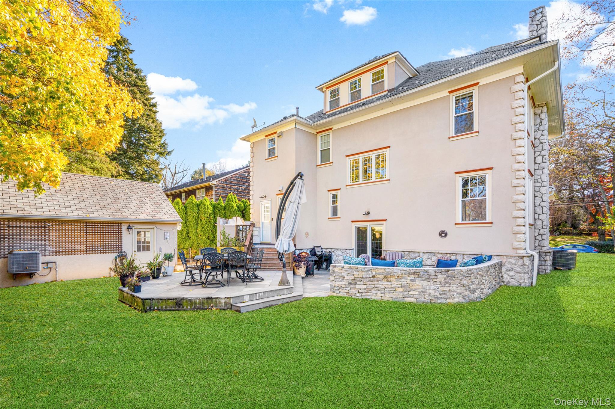 69 Irving Place New Rochelle, NY 10801 - Photo 40 of 46 a view of a backyard with plants and a patio