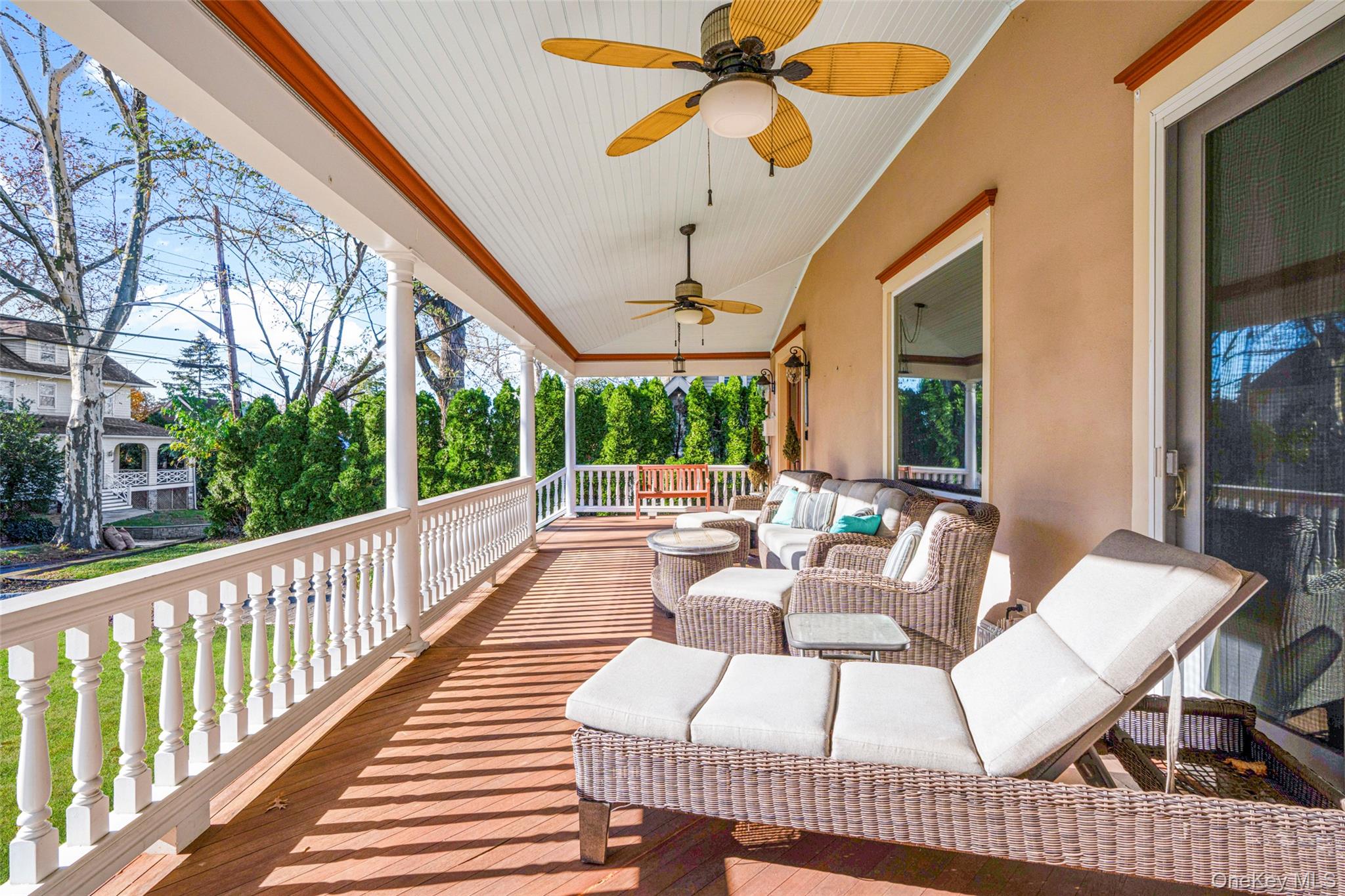 69 Irving Place New Rochelle, NY 10801 - Photo 4 of 46 a view of a patio with a dining table and chairs with wooden floor