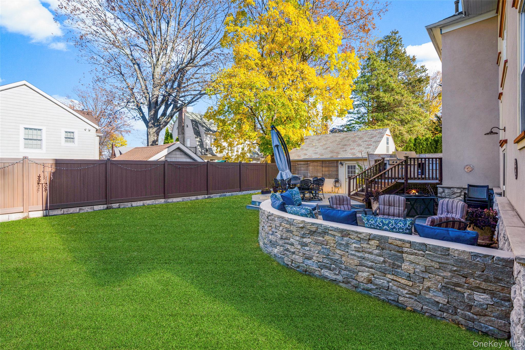 69 Irving Place New Rochelle, NY 10801 - Photo 41 of 46 a view of a house with backyard and a tree