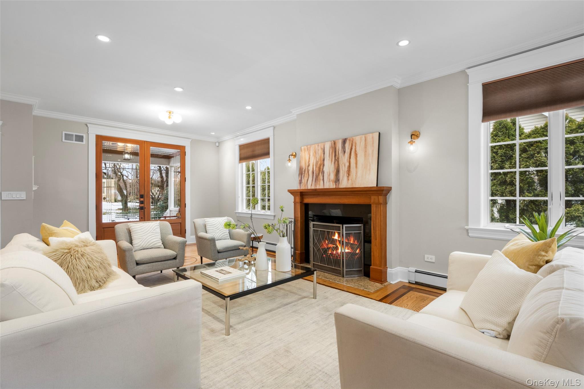 69 Irving Place New Rochelle, NY 10801 - Photo 5 of 46 a living room with furniture and a fireplace