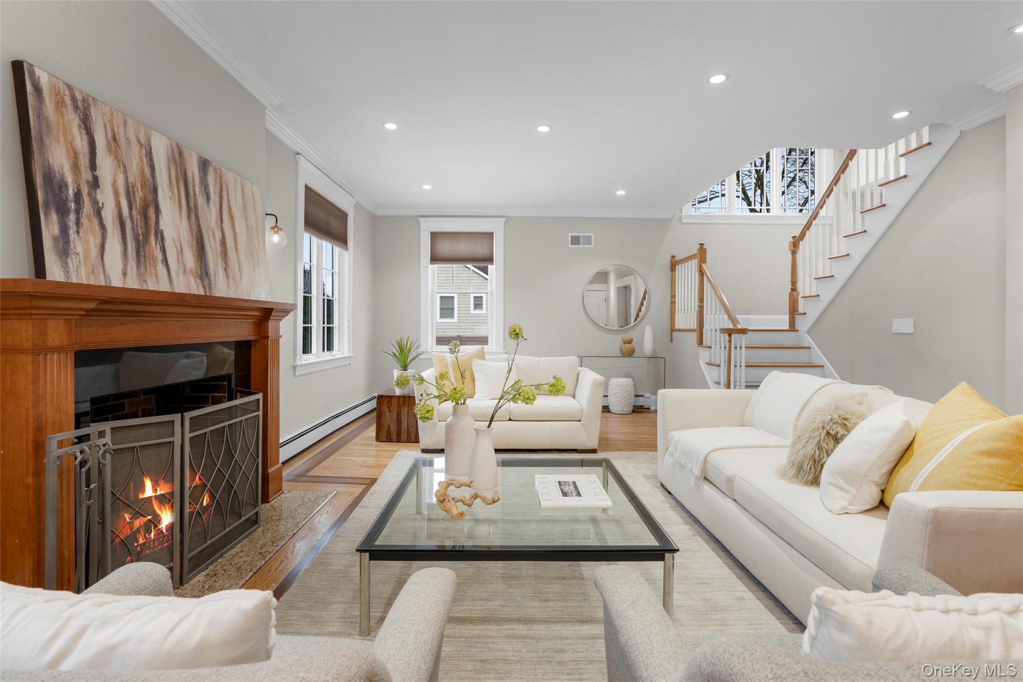 69 Irving Place New Rochelle, NY 10801 - Photo 7 of 46 a living room with furniture and a fireplace