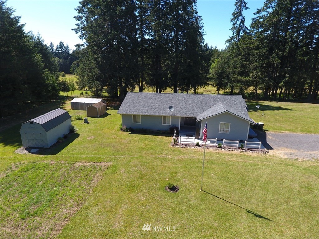 575 Telegraph Road Winlock, WA 98596 - Photo 1 of 30 a view of a house with swimming pool and sitting area