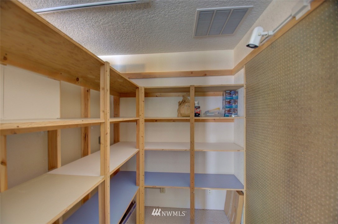 575 Telegraph Road Winlock, WA 98596 - Photo 23 of 30 a view of walk in closet with empty racks