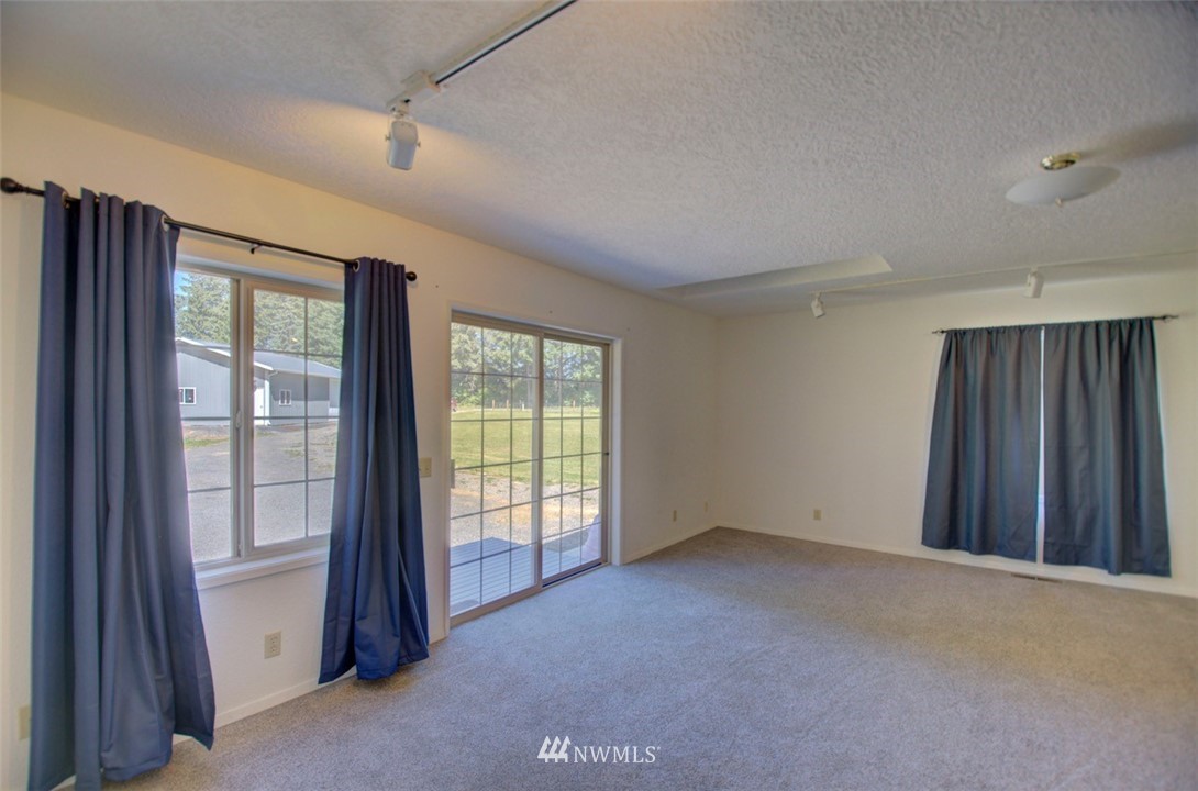 575 Telegraph Road Winlock, WA 98596 - Photo 4 of 30 a view of an empty room with a window