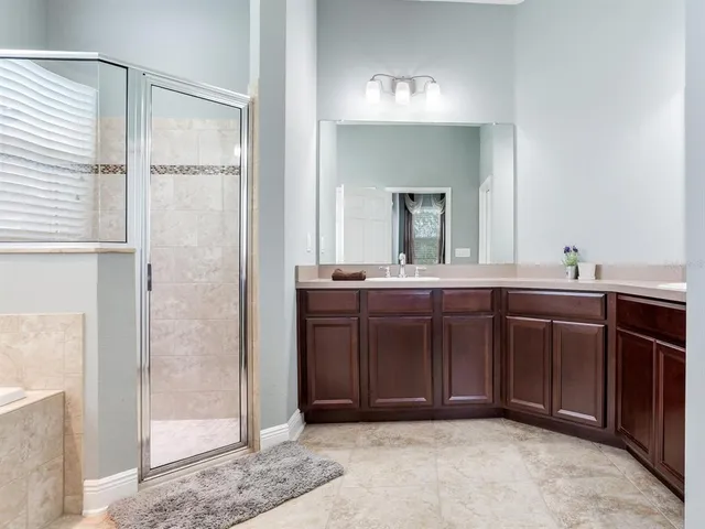 a bathroom with a tub and a sink