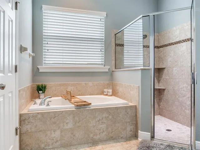 a bedroom with furniture and a baby crib