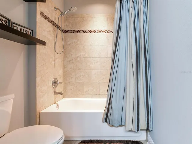 a bedroom with a bed and a cabinets