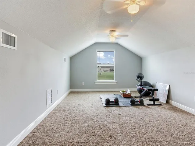a view of a backyard with swimming pool