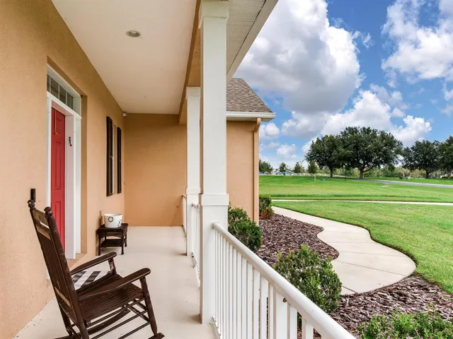 a view of a hallway with dining area