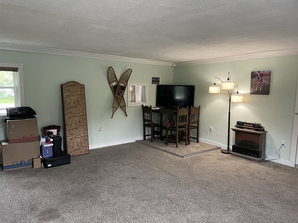 190 Turners Falls Road Montague, MA 01351 - Photo 2 of 35 a view of a workspace with furniture and a window