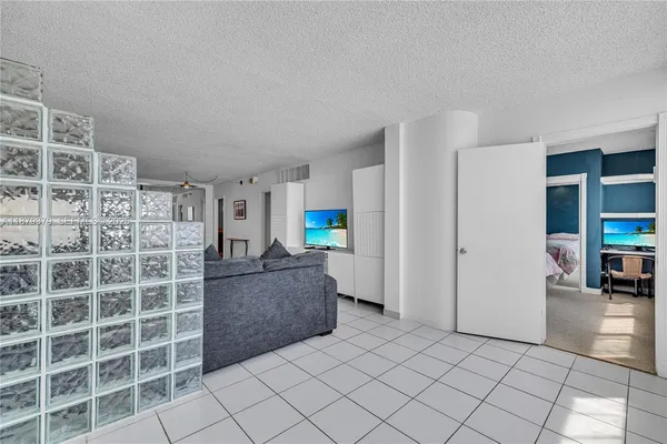a living room with furniture and walk in closet