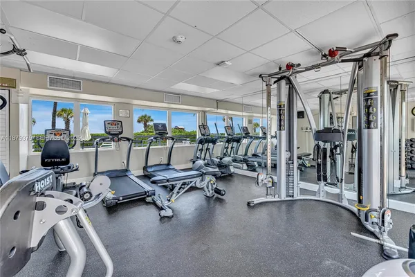 a view of a livingroom with gym equipment